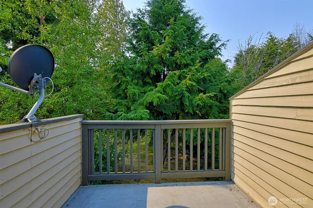 a view of a chair and table in the balcony