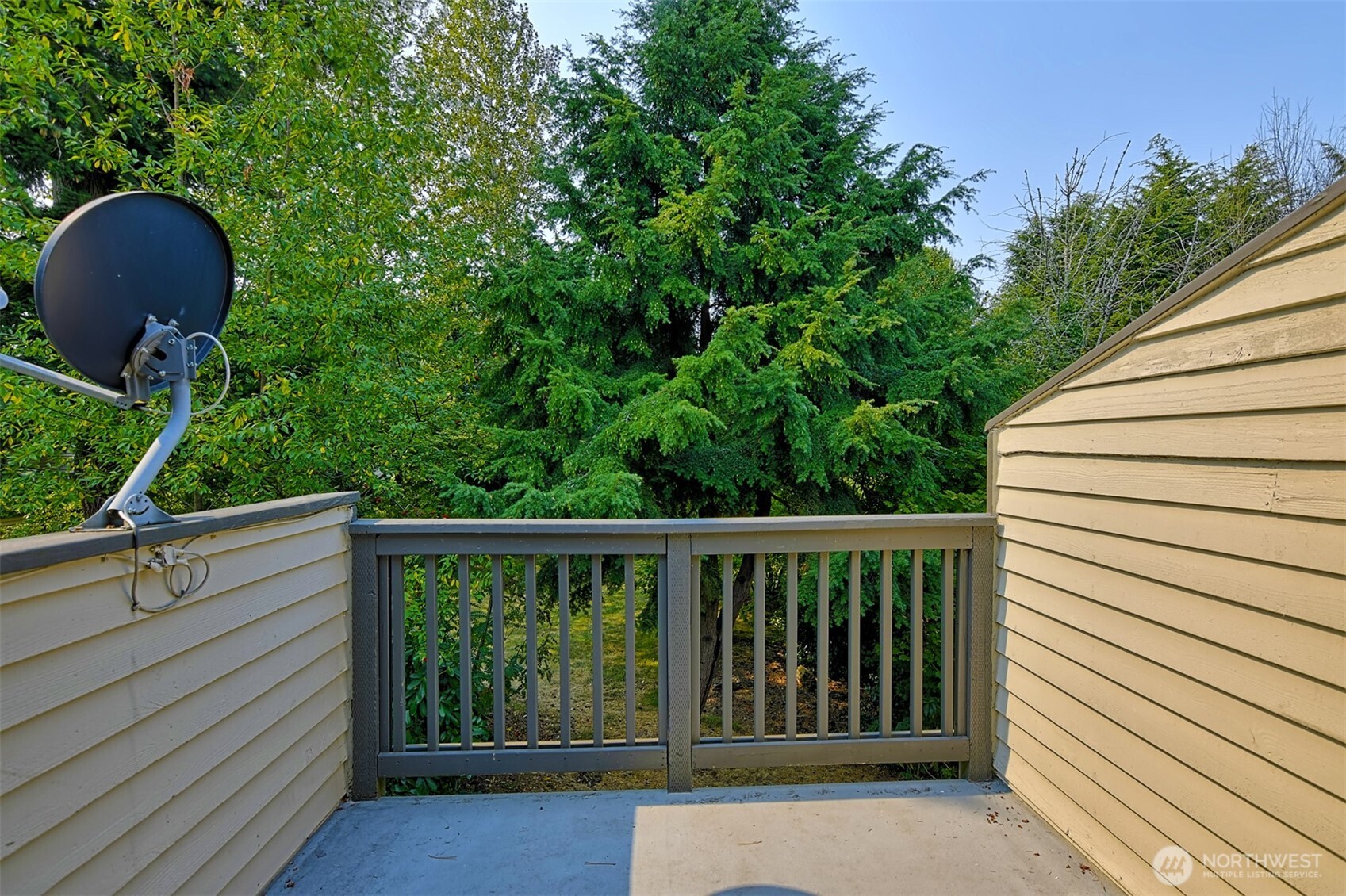 120 124th Street Southwest, Unit C8 Everett, WA 98204 - Photo 25 of 30 a view of a chair and table in the balcony