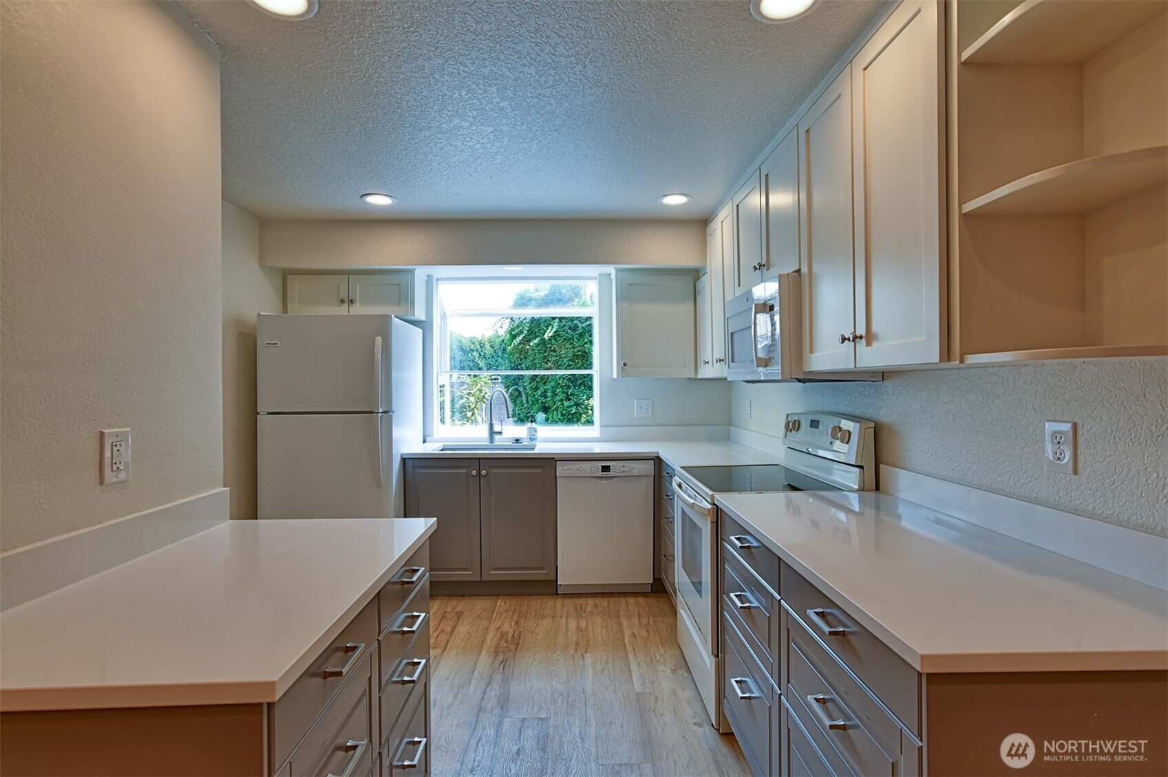 120 124th Street Southwest, Unit C8 Everett, WA 98204 - Photo 5 of 30 a kitchen with a sink a refrigerator and window