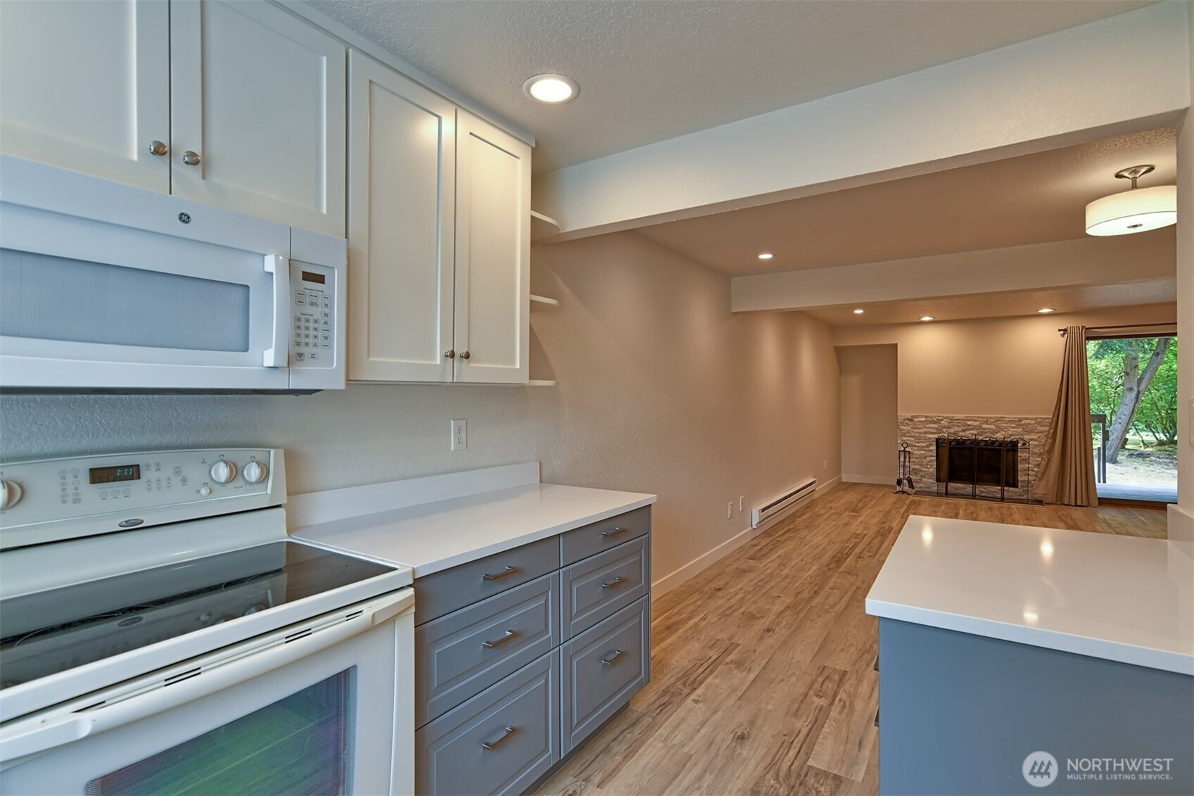 120 124th Street Southwest, Unit C8 Everett, WA 98204 - Photo 6 of 30 a kitchen with stainless steel appliances granite countertop a sink and a stove