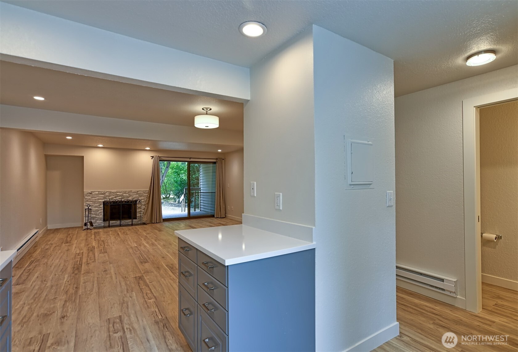 120 124th Street Southwest, Unit C8 Everett, WA 98204 - Photo 9 of 30 a view of a kitchen with a sink and a fireplace