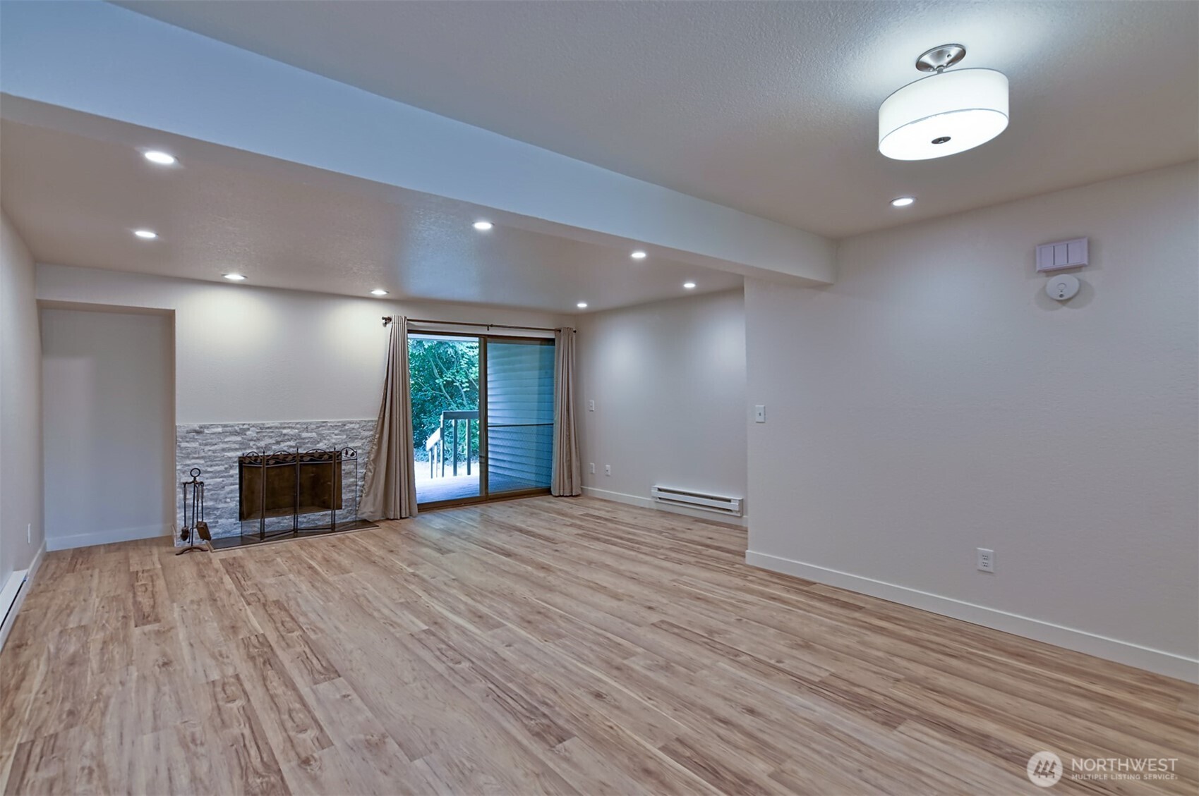 120 124th Street Southwest, Unit C8 Everett, WA 98204 - Photo 10 of 30 an empty room with windows and fireplace