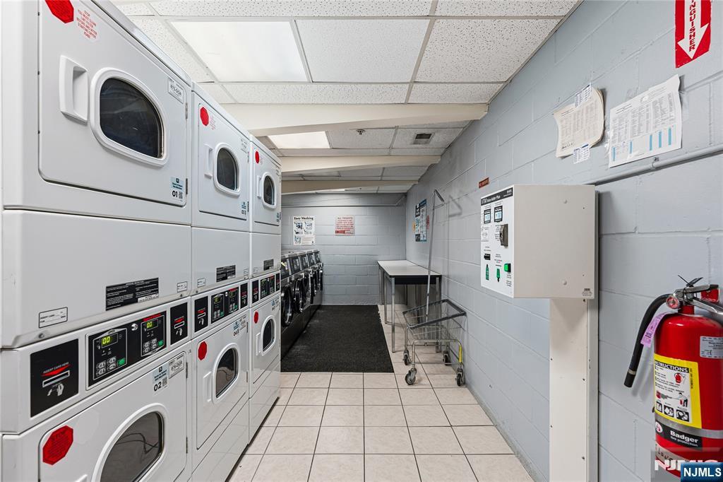 905 River Road, Unit 307 Edgewater, NJ 07020 - Photo 17 of 32 a utility room with dryer and washer