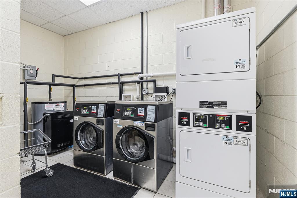 905 River Road, Unit 307 Edgewater, NJ 07020 - Photo 19 of 32 a utility room with dryer and washer
