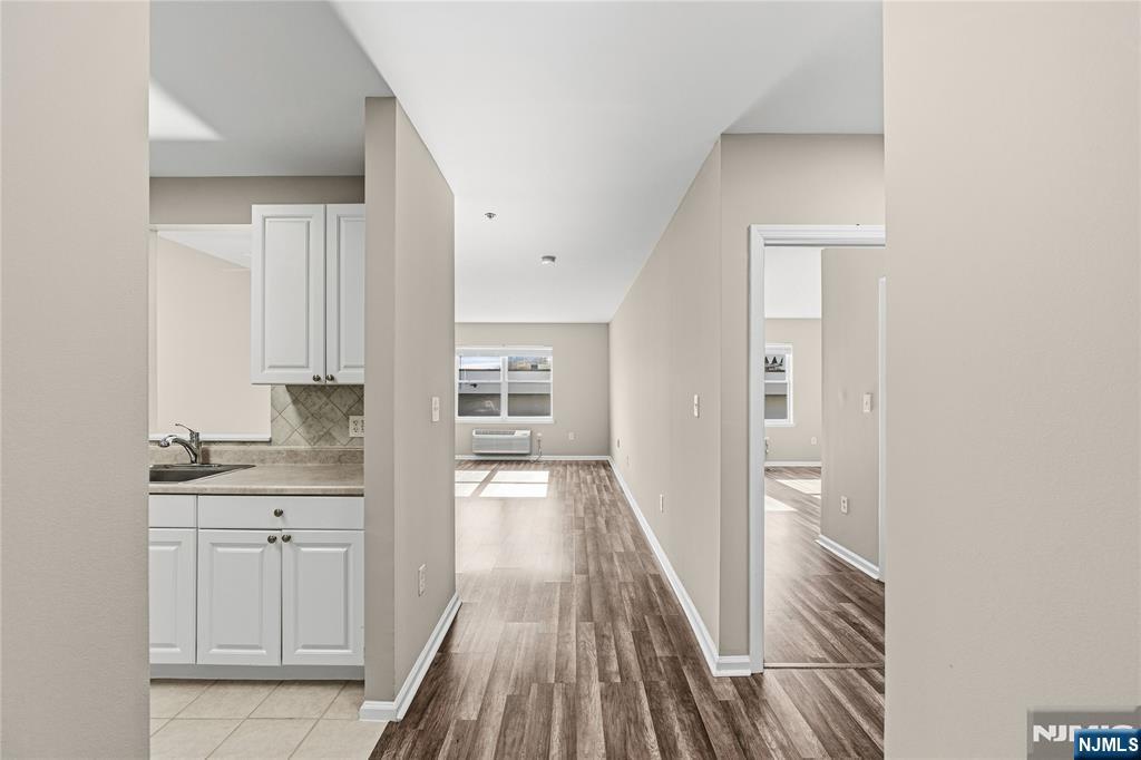 905 River Road, Unit 307 Edgewater, NJ 07020 - Photo 3 of 34 a view of a kitchen from the hallway