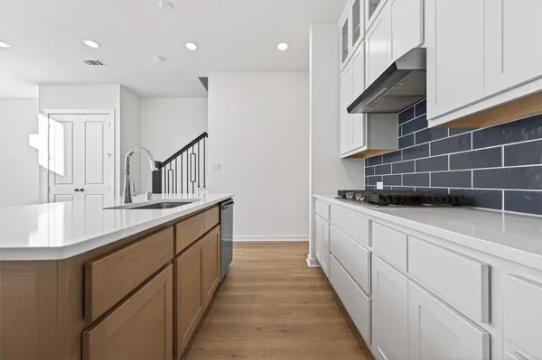a kitchen with a sink and cabinets