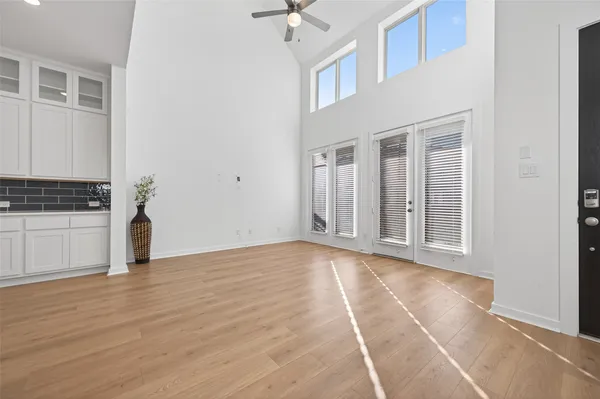 a view of kitchen with kitchen island and stainless steel appliances