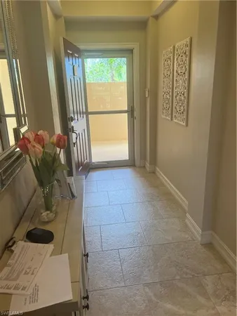 a view of an empty room and a window
