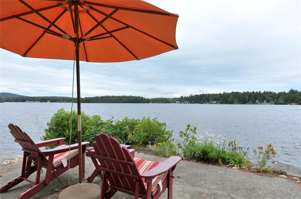 21 Island Road Ashburnham, MA 01430 - Photo 1 of 27 a view of a lake from a lounge chair