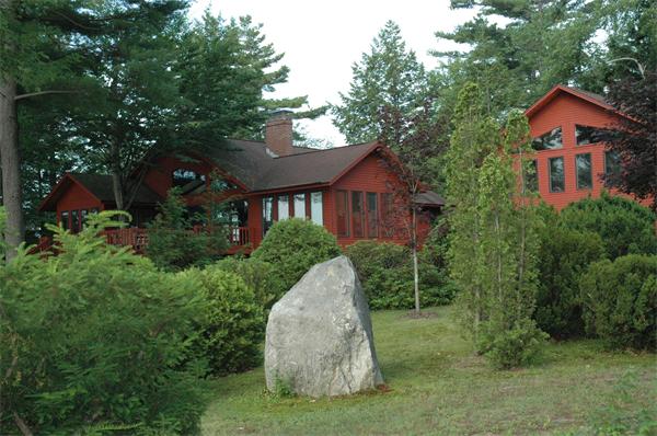 21 Island Road Ashburnham, MA 01430 - Photo 25 of 27 a view of a small house with a yard and plants