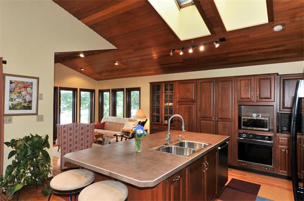 21 Island Road Ashburnham, MA 01430 - Photo 6 of 27 a kitchen with a table chairs stove and refrigerator