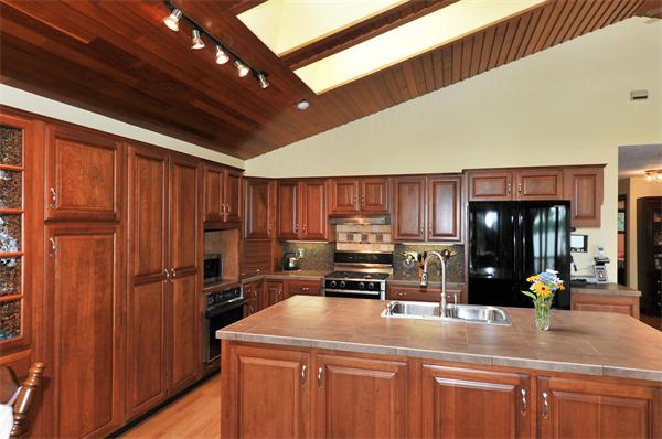 21 Island Road Ashburnham, MA 01430 - Photo 7 of 27 a kitchen with kitchen island a counter top space and cabinets