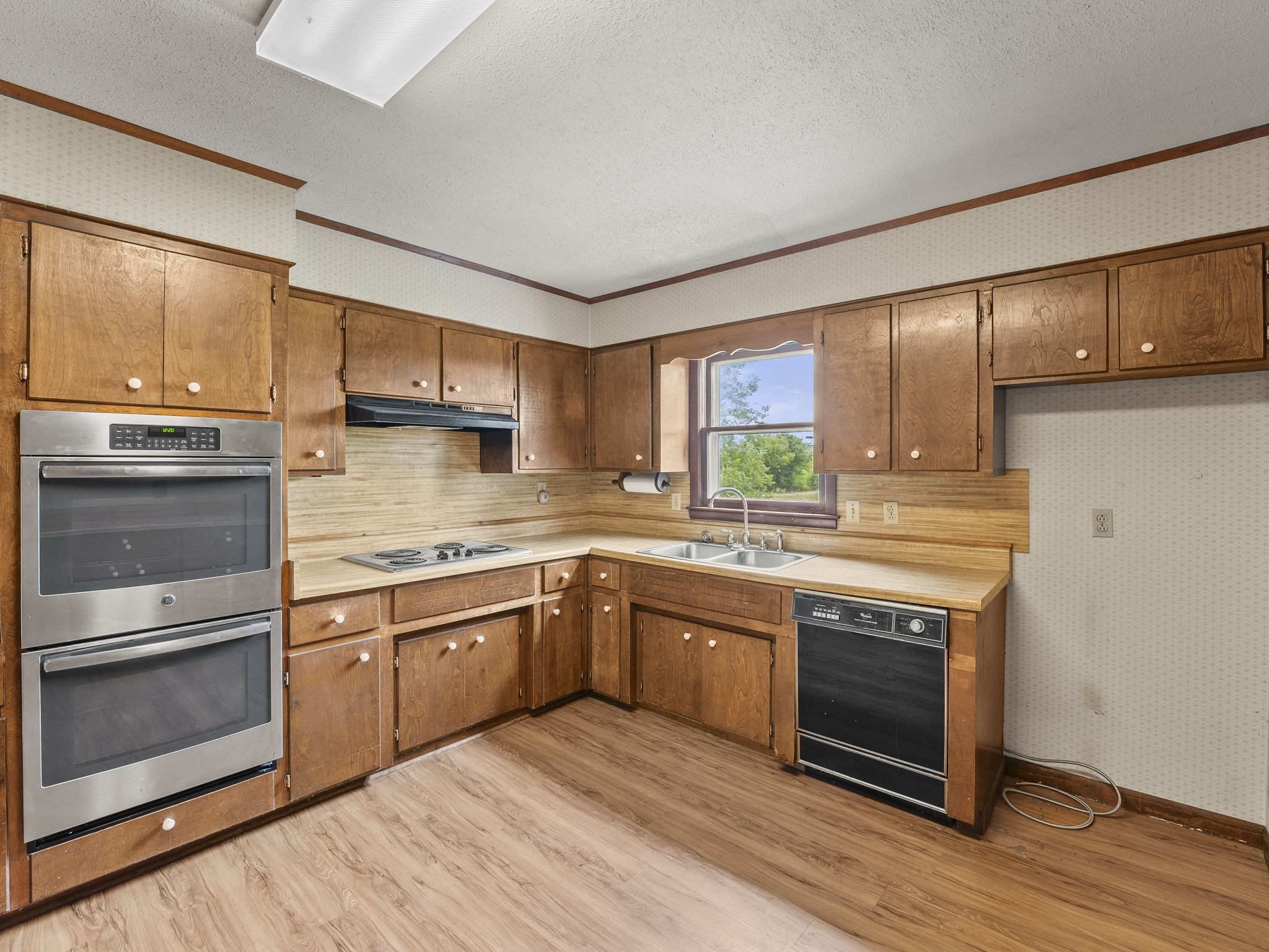 161 Stewarts Chapel Road Flintville, TN 37335 - Photo 24 of 39 a kitchen with stainless steel appliances granite countertop a stove and a sink