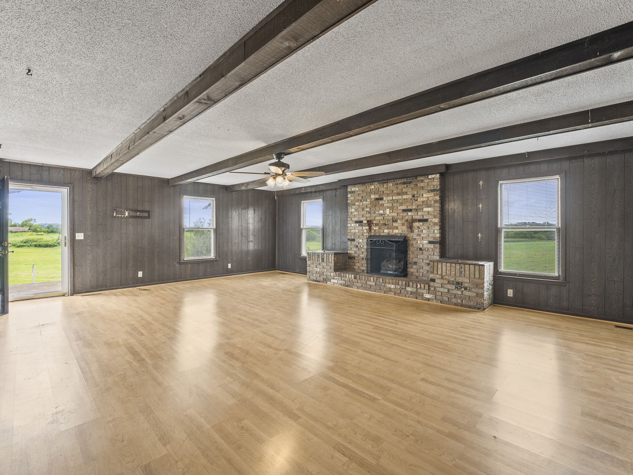 161 Stewarts Chapel Road Flintville, TN 37335 - Photo 29 of 39 a view of empty room with wooden floor and fireplace