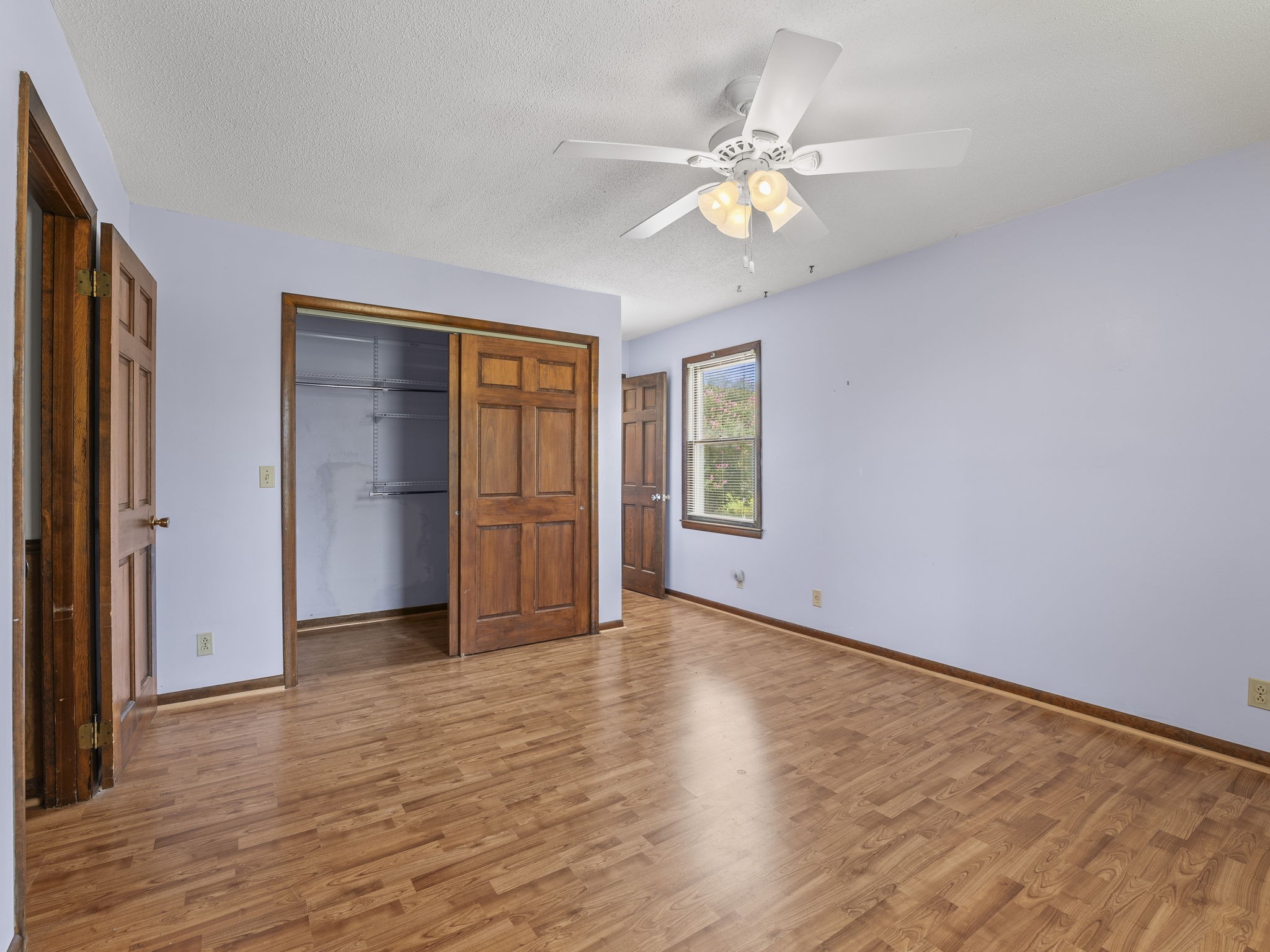 161 Stewarts Chapel Road Flintville, TN 37335 - Photo 33 of 39 a view of an empty room with window and wooden floor