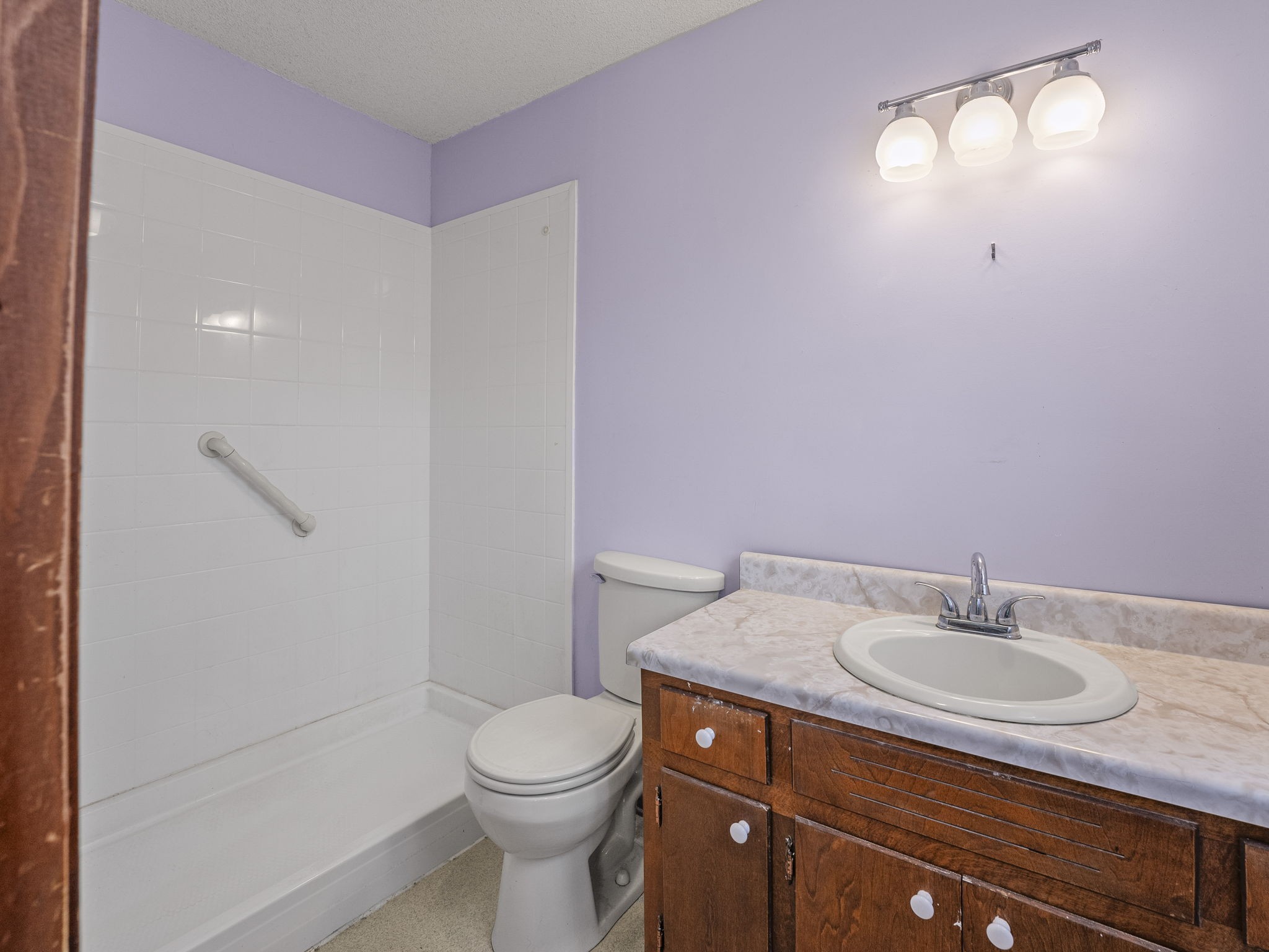 161 Stewarts Chapel Road Flintville, TN 37335 - Photo 34 of 39 a bathroom with a sink toilet vanity and shower