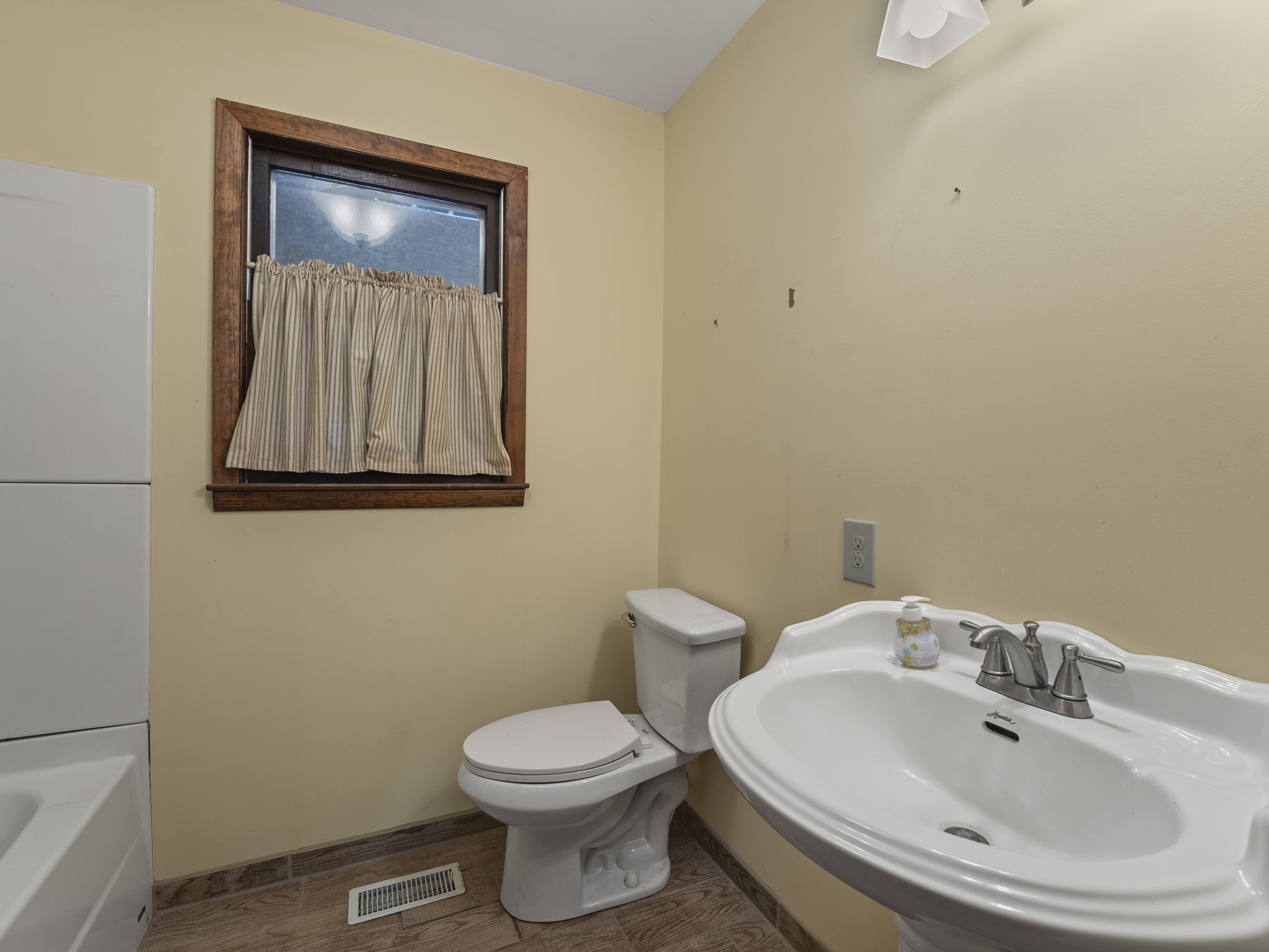 161 Stewarts Chapel Road Flintville, TN 37335 - Photo 37 of 39 a bathroom with a toilet sink and mirror