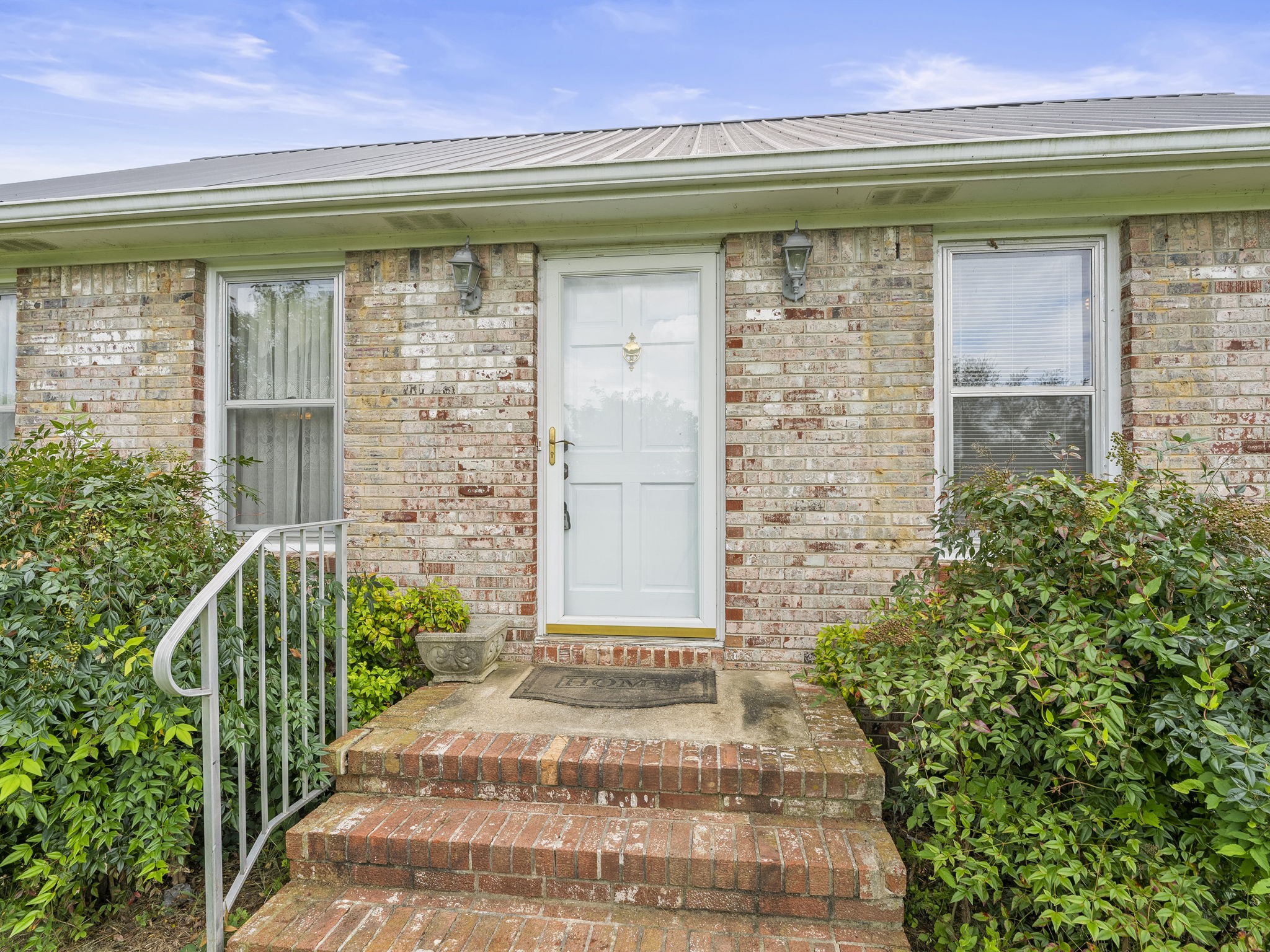 161 Stewarts Chapel Road Flintville, TN 37335 - Photo 9 of 39 a front view of a house with a garden