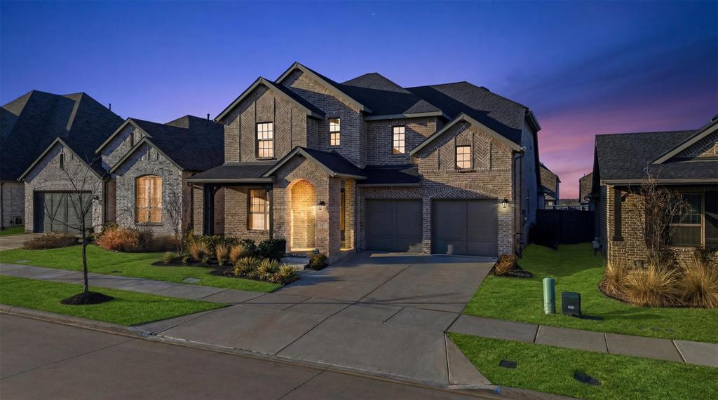 537 Oakmoss Street Little Elm, TX 76227 - Photo 2 of 39 a front view of a house with a yard