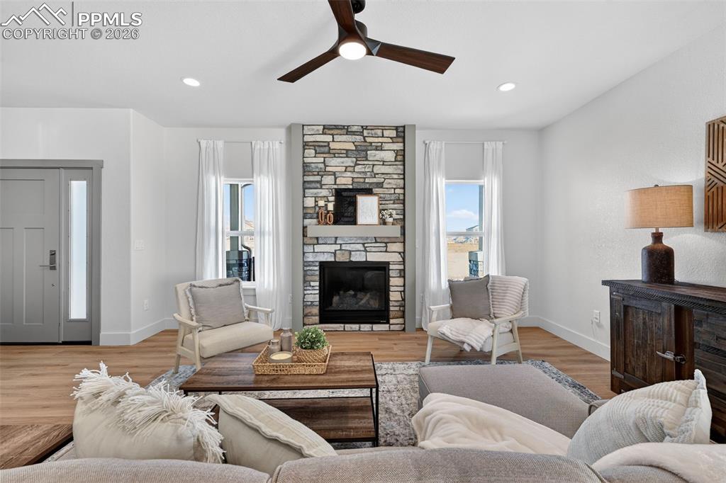 12955 Sunrise Ridge Drive Peyton, CO 80831 - Photo 16 of 49 a living room with furniture and a fireplace