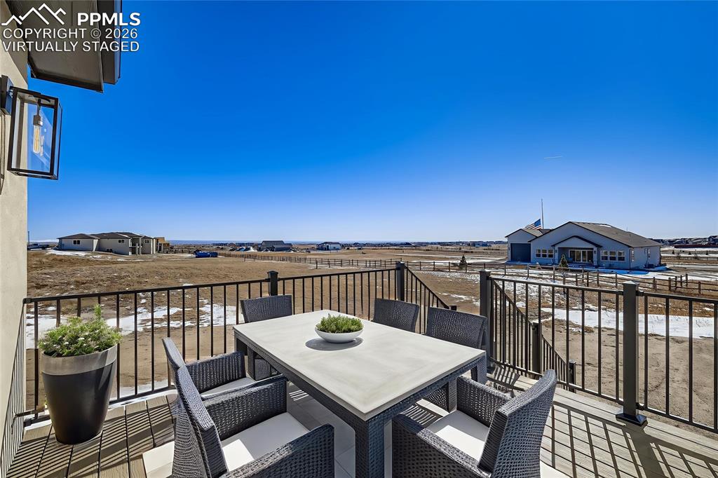 12955 Sunrise Ridge Drive Peyton, CO 80831 - Photo 24 of 49 Virtually staged. Composite deck offers effortless indoor-outdoor living and entertaining space.