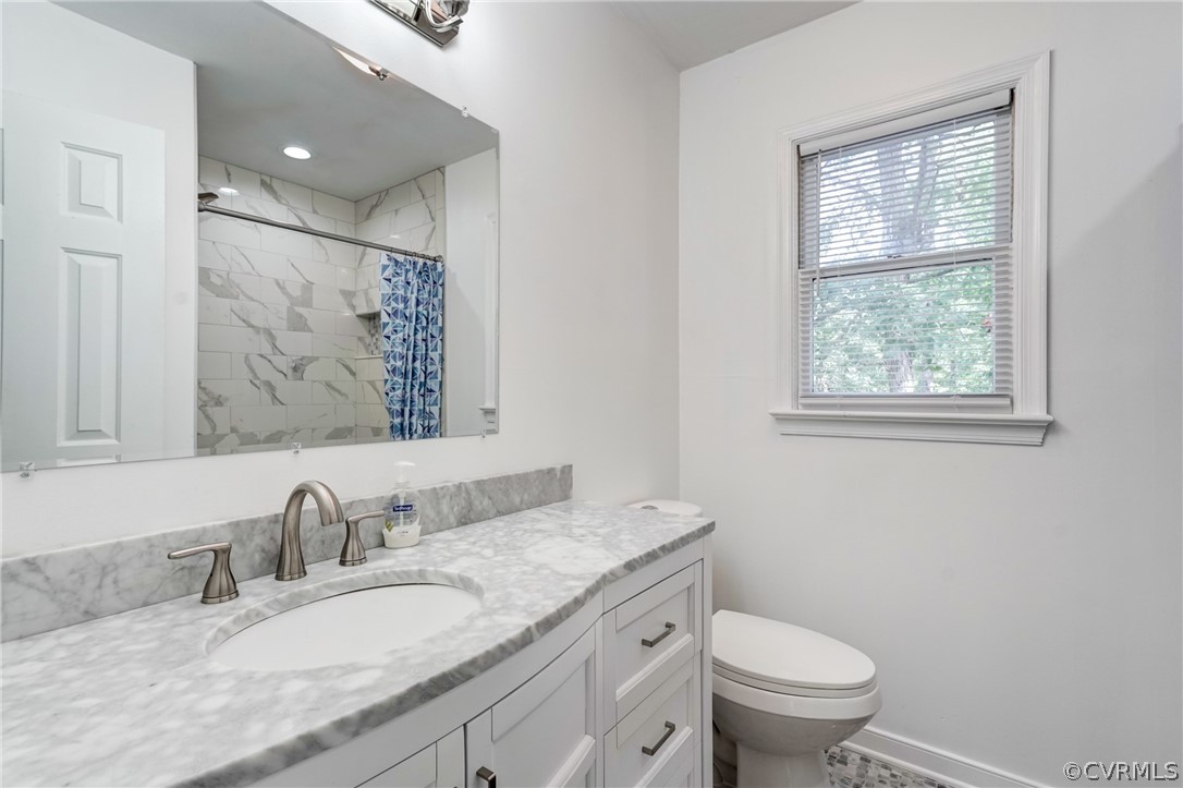 10618 Ridgerun Road Chesterfield, VA 23832 - Photo 26 of 36 a bathroom with a granite countertop sink mirror vanity and toilet