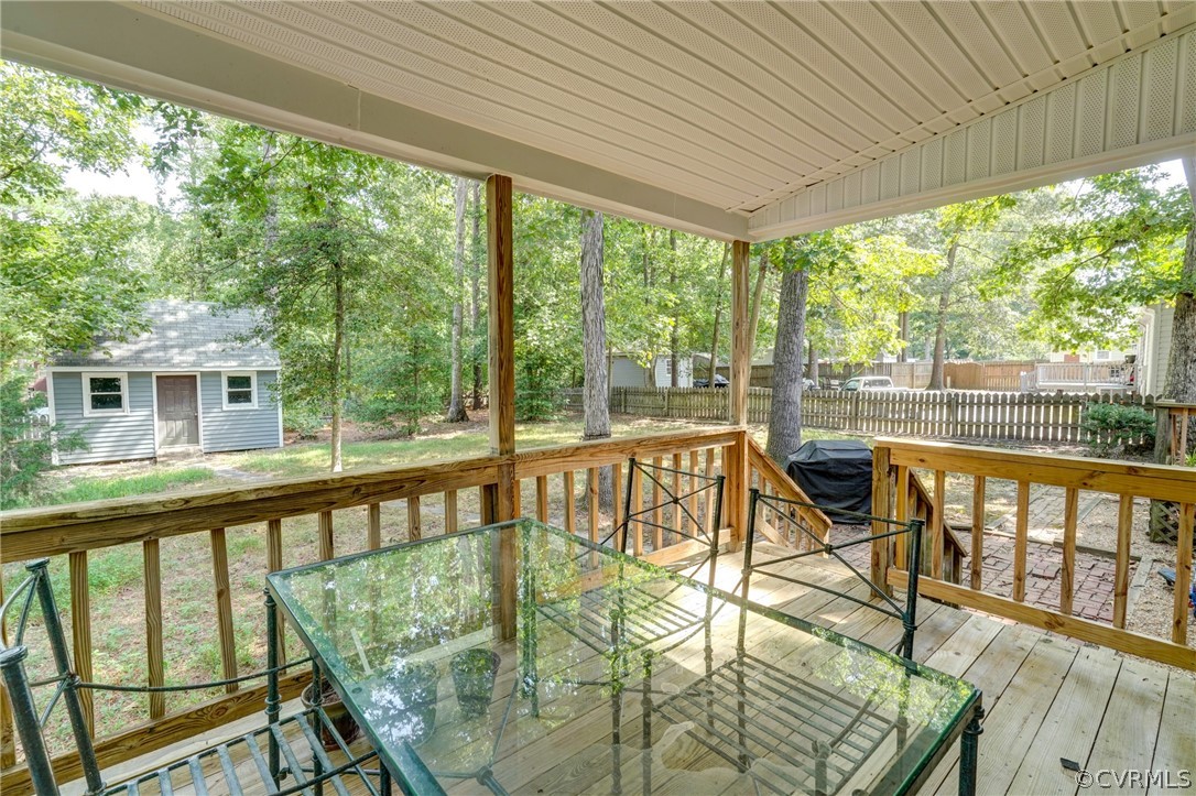 10618 Ridgerun Road Chesterfield, VA 23832 - Photo 28 of 36 a view of a balcony with chairs and wooden floor