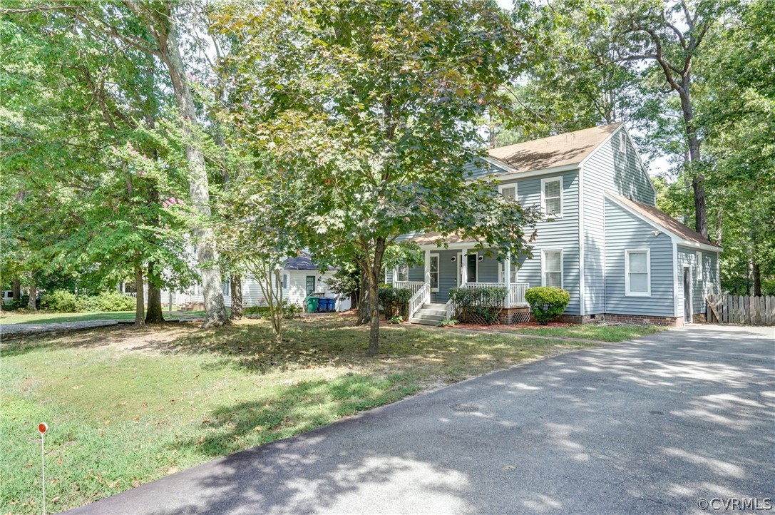 10618 Ridgerun Road Chesterfield, VA 23832 - Photo 29 of 36 a front view of a house with a yard and trees