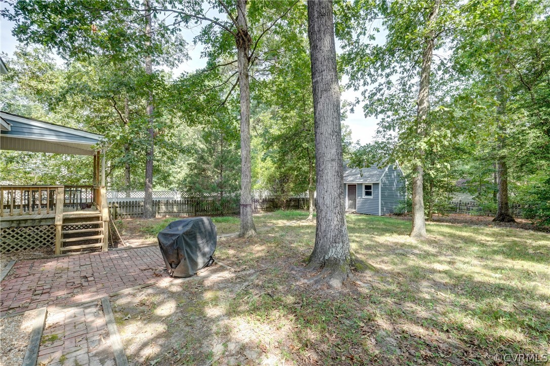 10618 Ridgerun Road Chesterfield, VA 23832 - Photo 32 of 36 a backyard of a house with basket ball court and outdoor seating