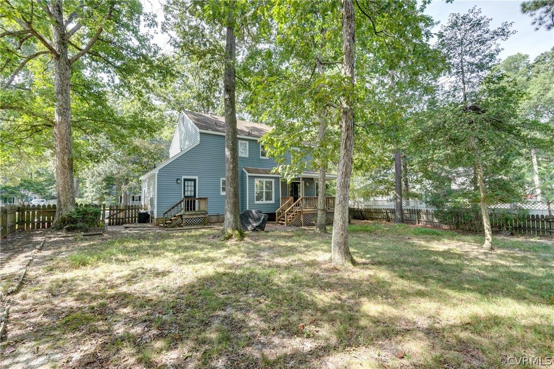 10618 Ridgerun Road Chesterfield, VA 23832 - Photo 33 of 36 a house with trees in the background