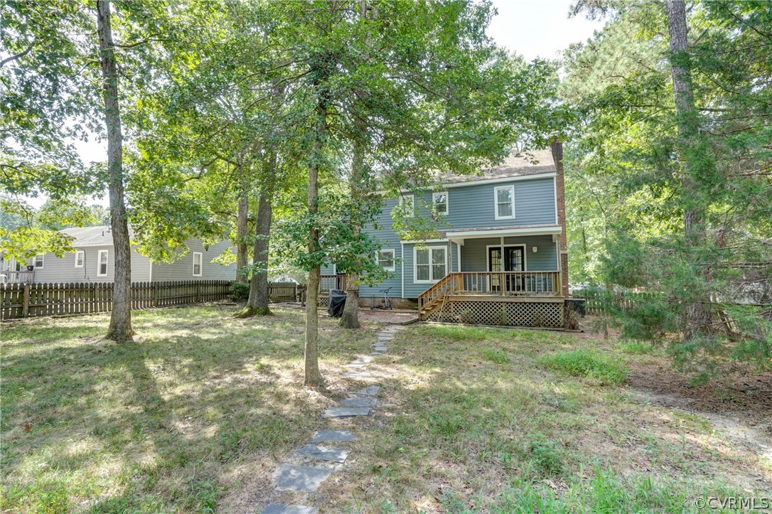 10618 Ridgerun Road Chesterfield, VA 23832 - Photo 36 of 36 a view of a house with a small yard and a large tree
