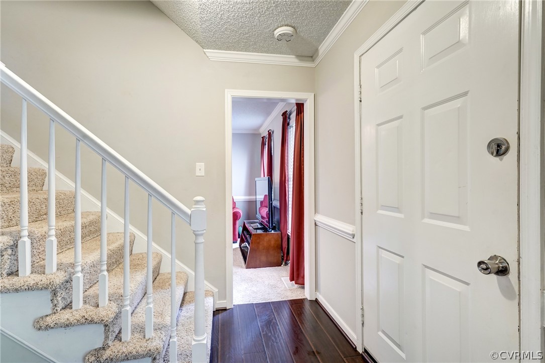 10618 Ridgerun Road Chesterfield, VA 23832 - Photo 4 of 36 a view of a hallway with wooden floor and staircase