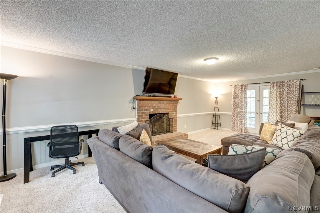 10618 Ridgerun Road Chesterfield, VA 23832 - Photo 5 of 36 a living room with furniture fireplace and a flat screen tv