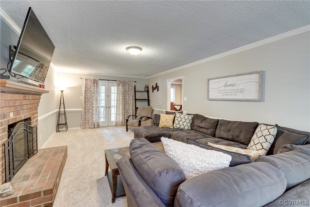 10618 Ridgerun Road Chesterfield, VA 23832 - Photo 6 of 36 a living room with furniture fireplace and a flat screen tv