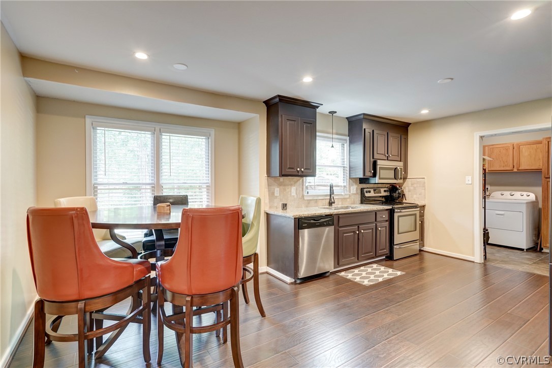 10618 Ridgerun Road Chesterfield, VA 23832 - Photo 9 of 36 a kitchen with stainless steel appliances granite countertop a table chairs refrigerator a sink dishwasher and microwave