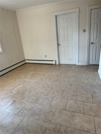 a view of an empty room and entryway