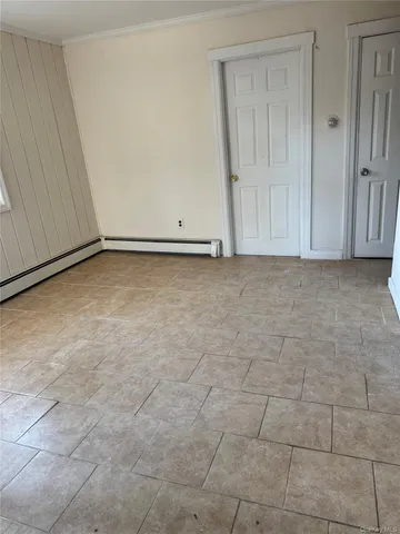 a view of an empty room and entryway