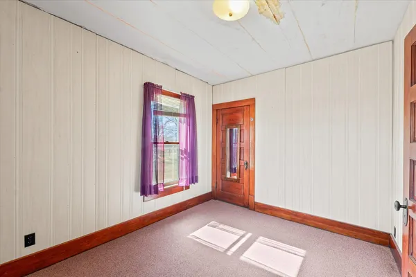 a view of an empty room and window