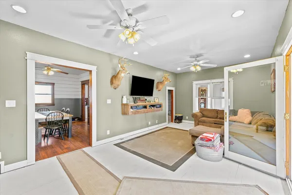 a room with furniture and a flat screen tv