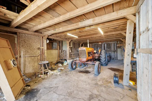 a view of a patio with table and chairs
