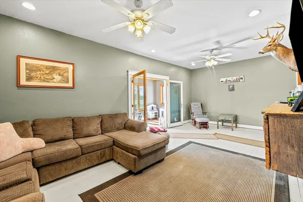 a living room with furniture and a large window