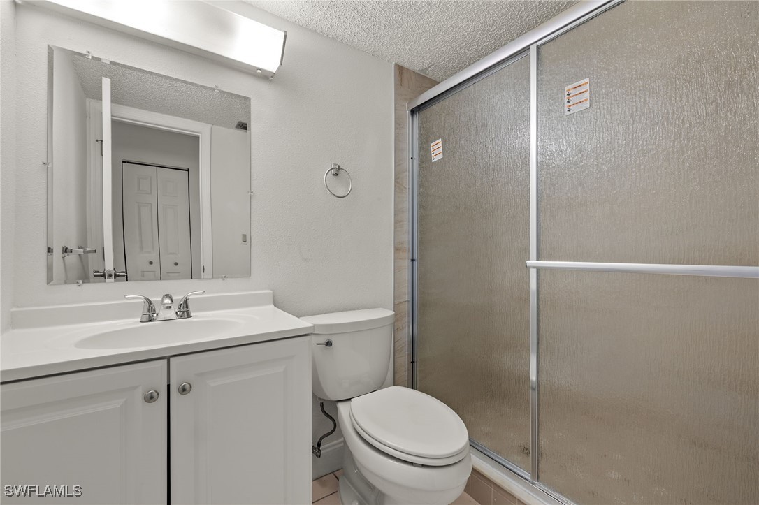 7068 Nantucket Circle, Unit 3 North Fort Myers, FL 33917 - Photo 11 of 17 a bathroom with a sink toilet and shower
