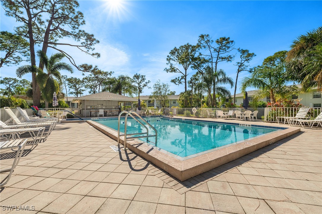 7068 Nantucket Circle, Unit 3 North Fort Myers, FL 33917 - Photo 16 of 17 a view of swimming pool with outdoor seating