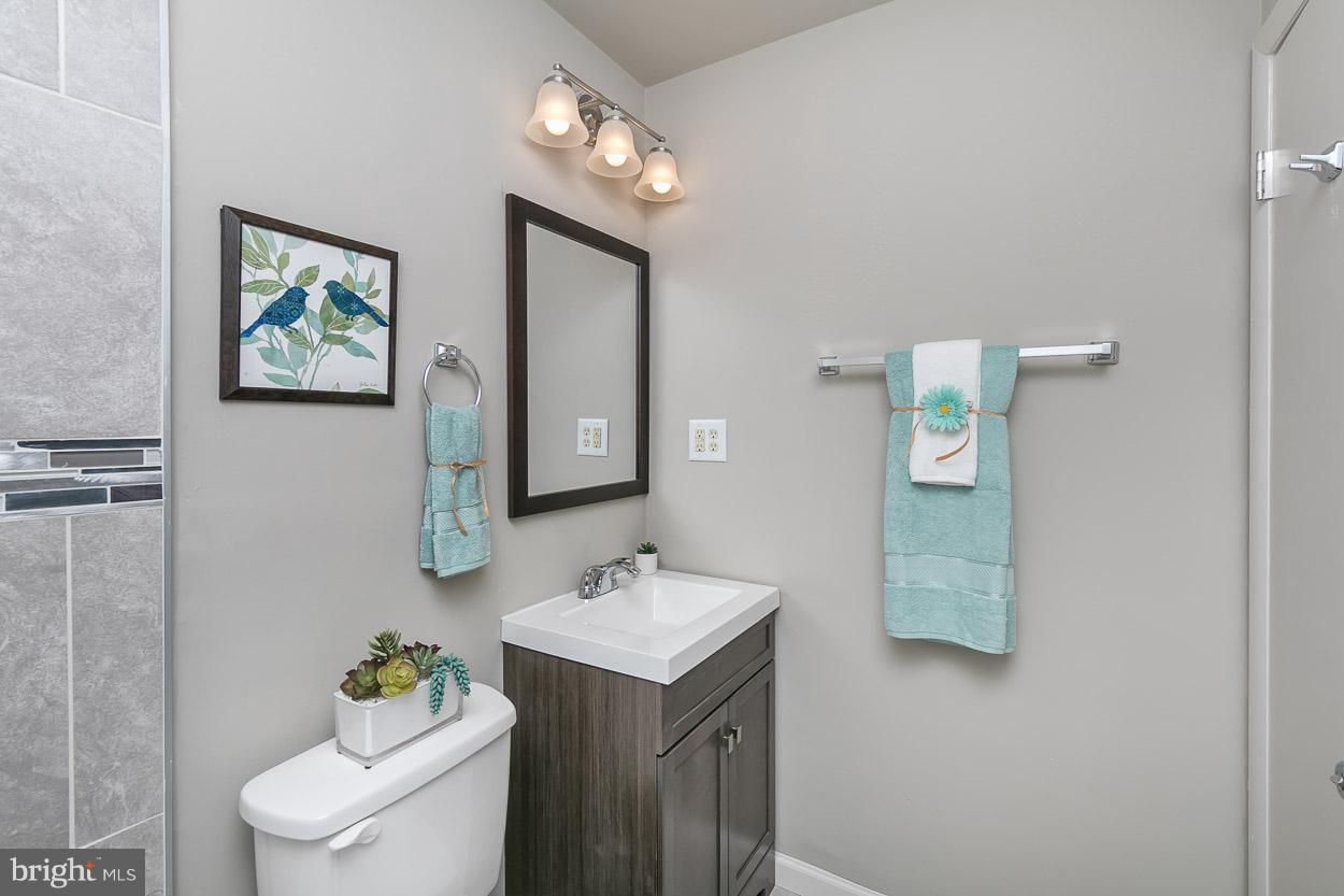 2801 Page Court Fallston, MD 21047 - Photo 21 of 30 a bathroom with a sink mirror and toilet