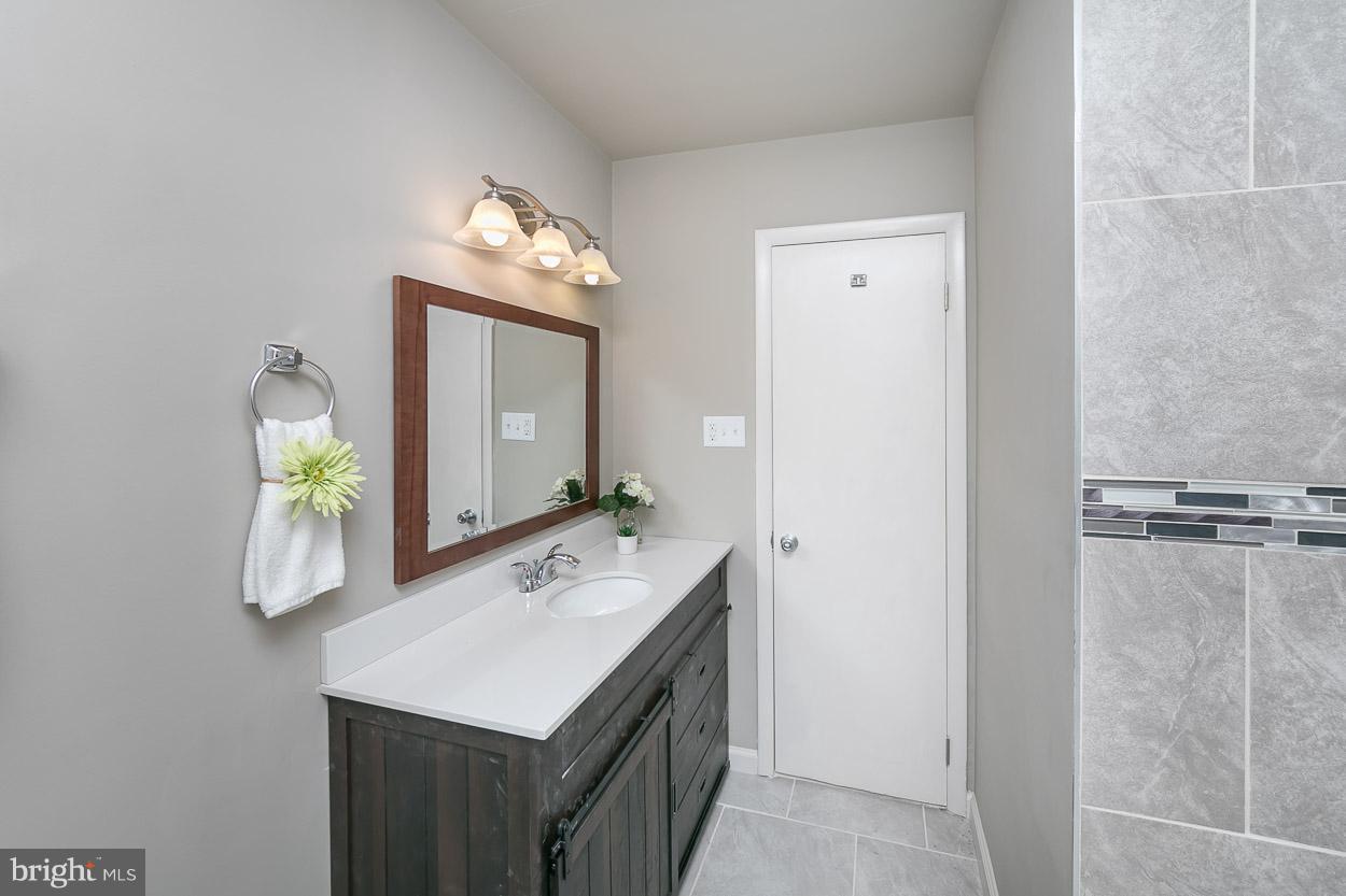 2801 Page Court Fallston, MD 21047 - Photo 25 of 30 a bathroom with a sink and a mirror