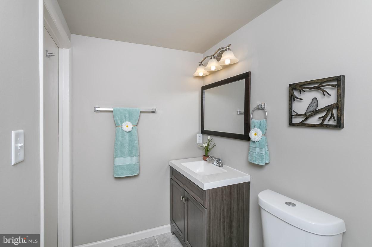 2801 Page Court Fallston, MD 21047 - Photo 29 of 30 a bathroom with a toilet sink and mirror