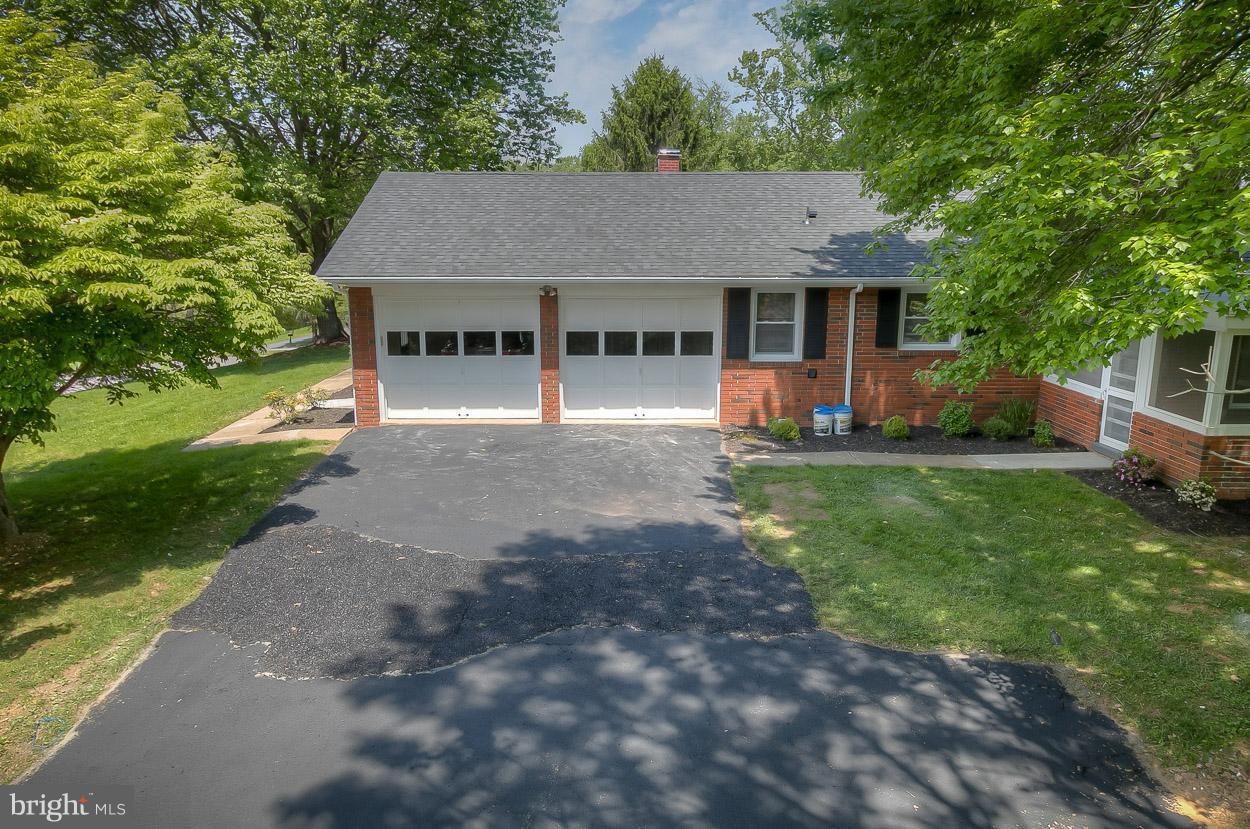2801 Page Court Fallston, MD 21047 - Photo 6 of 30 a front view of a house with a garden and trees