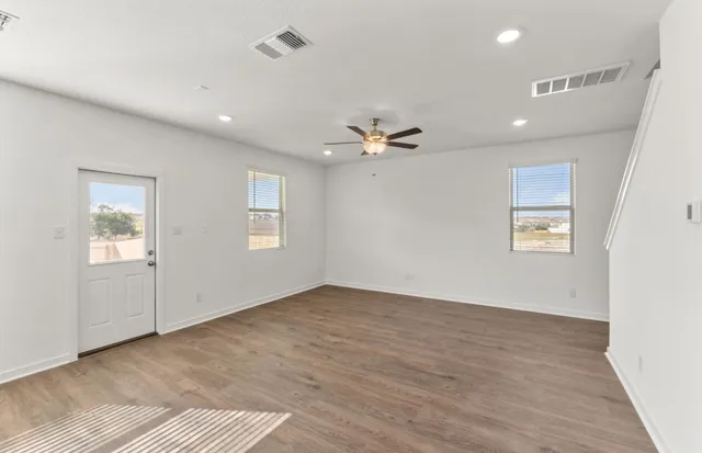 a kitchen with granite countertop a stove and a sink