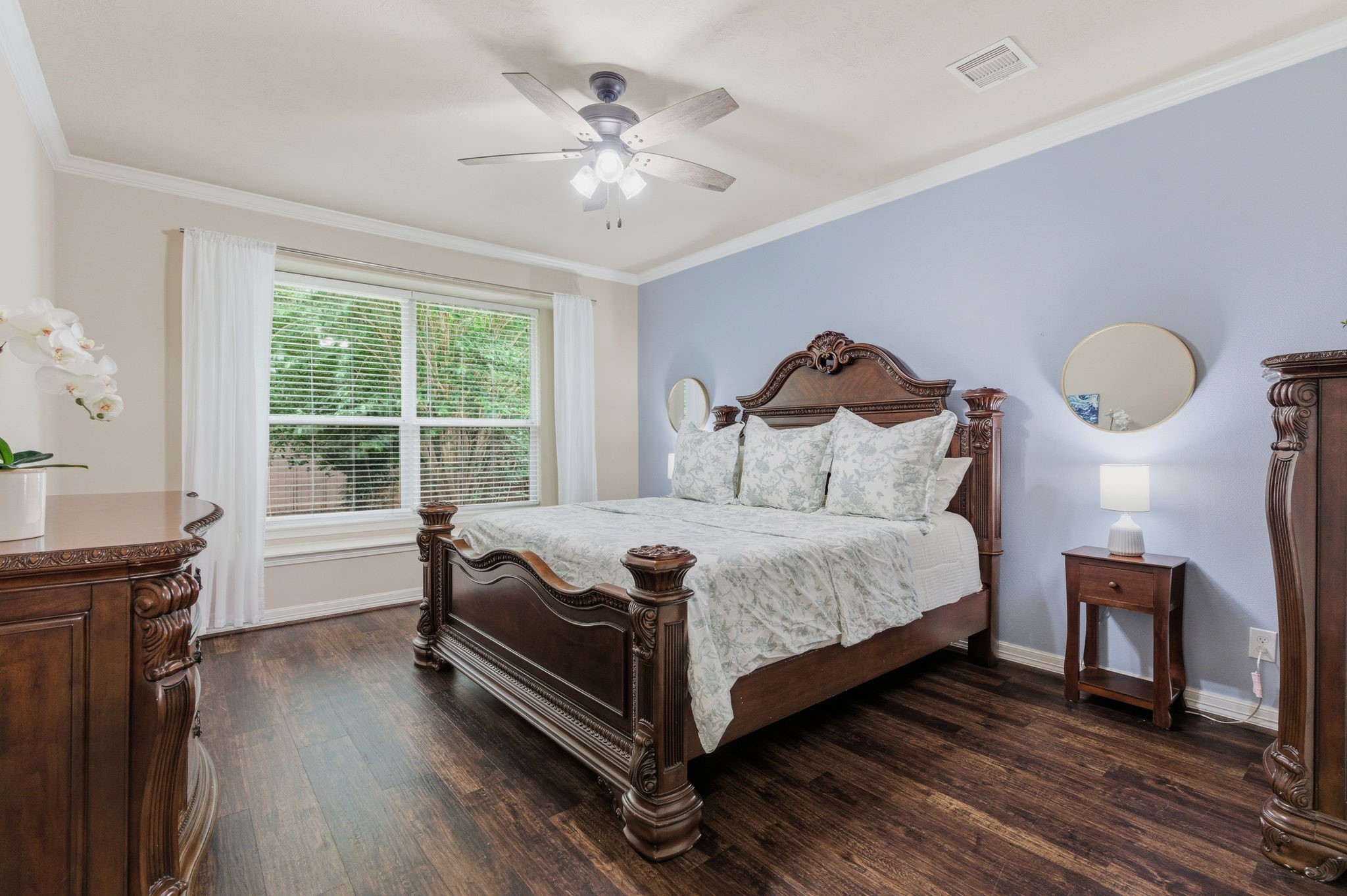 1737 Round Oak Lane Conroe, TX 77304 - Photo 8 of 39 a bedroom with a bed and a chandelier