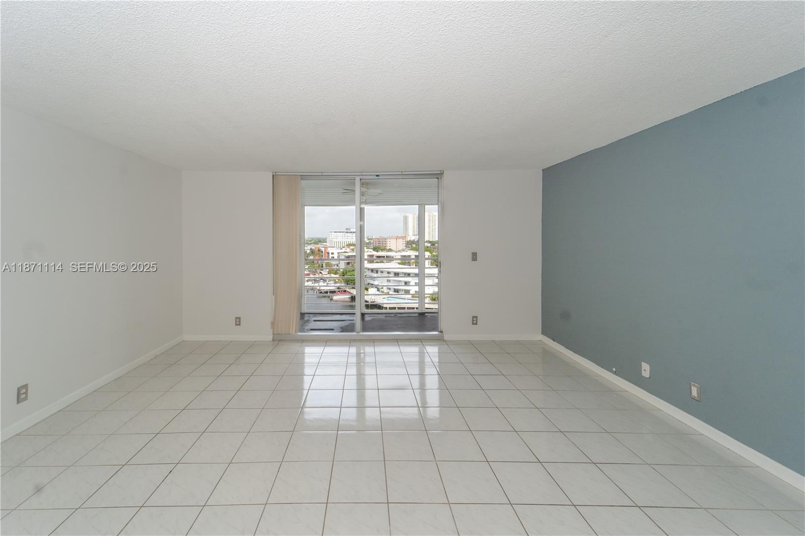 100 Golden Isles Drive, Unit 809 Hallandale Beach, FL 33009 - Photo 11 of 18 an empty room with windows